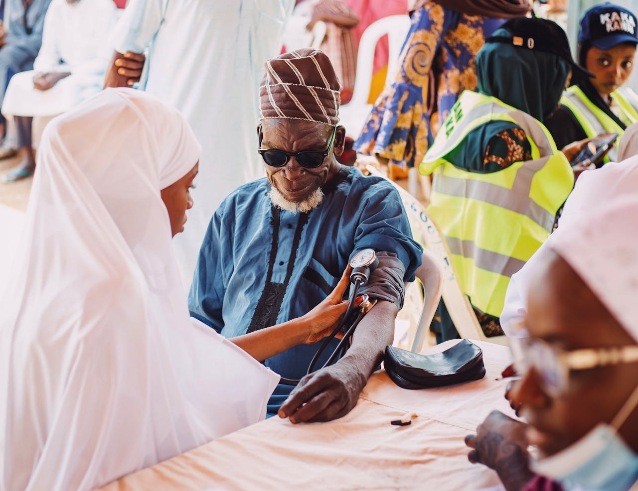 Elderly man receives medical care during community health outreach in Kaduna, Nigeria.